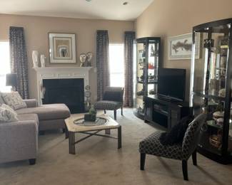 Two glass and wood display cabinets by Howard Miller are a beautiful addition to any home.