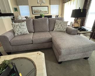 A brand new sofa chaise is available.  Chaise has moveable ottoman to allow to move it to either side. Pillows included.