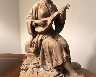 Girl playing Musical Instrument 