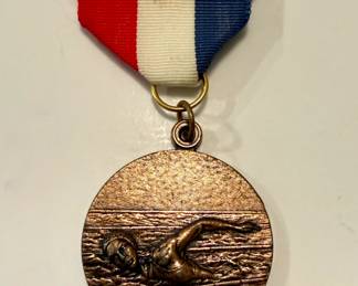 Vintage bronzed swimming medal