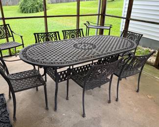 Wrought iron dining table with 8 chairs and 2 leafs