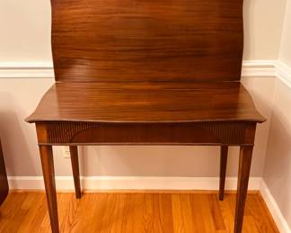 Flip-top game/console/dining table with 3 additional leaves...extends to 6 feet.
