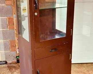 Vintage medical instrument cabinet in original enamel finish with original glass shelves...