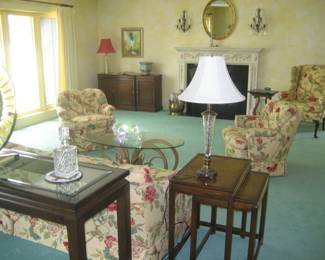 Nesting end tables, crystal decanter and table lamp, coffee table, bird print upholstered chairs