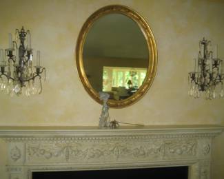 Crystal wall sconces, gold framed mirror