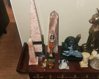 Egyptian motif collectibles Tall Pink Marble/granite Obelisk 14.5" $100 Purple agate? Medium Obelisk $ 50 Smaller Quartz ? Obelisk $ 50 Ancient Egyptian Goddess -missing the headpiece $5