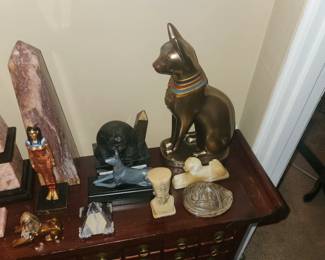 Baset, Daughter of Sun god Ra, was the goddess of protection of home, family & childbirth; and the patron goddess of firefighters due to the belief that a cat running through a burning building would draw the flames out. $100