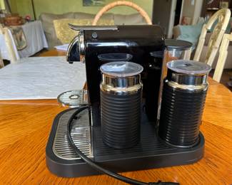 Nespresso CitiZ Coffee and Espresso Machine by De'Longhi with Milk Frother, Black, 9.3 x 14.6 x 10.9 inches. Comes with two cups, and a separate warming accessory purchased separately. Comes with multiple unopened sleeves of coffee.