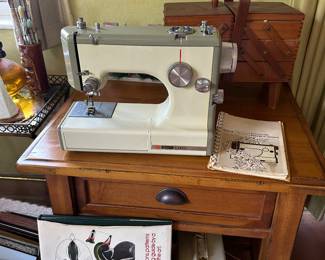 Sears vintage sewing machine with peddle and instruction manual