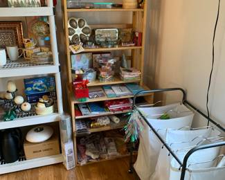 Gift wrapping, gift bags, cookie cutters and more! The cabinet below is for sale, the top shelf is not