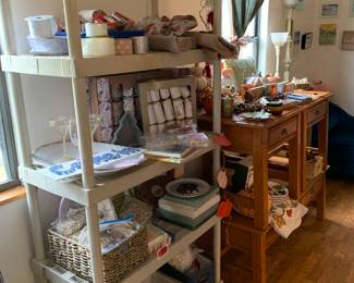 Holiday crackers, napkins, placemats, paper plates, and a stacked coffee table/side table set from pottery barn