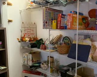Games, toys, miscellaneous decor, decorative pillows on the top shelf