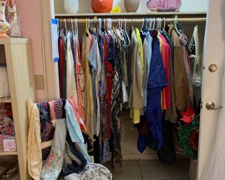 Another FULL closet of dresses, jackets, skirts and more. Scarves, a boot drier…