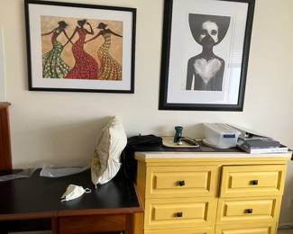 L: framed print titled "Rhythm" by Monica Stewart
R: "Hold On" art print by Ruben Ireland.