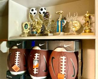 New in box footballs, tropies