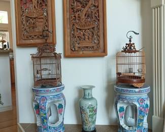 Plant stands, carved wood panels and ornate bird cages