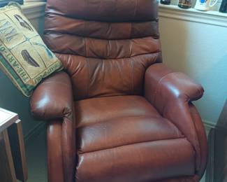 Comfy leather chair.  Does not rock, but it does recline