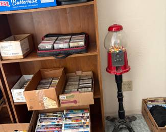 Gum ball machine and picture frames bookshelf and sealed disney vhs