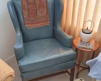 Leather Wing back chair
Small round side table
Vintage milk glass biscuit jar