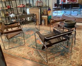 Two sets of Wassily. One original, one reproduction.