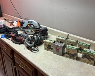 Shotgun shells, circular saw, tools