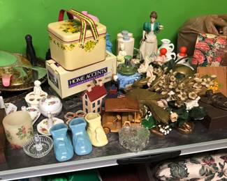 Ceramic baby shoes, jewelry trays vanity, Avon bottles, lipstick holders, ring holders, lots of other items 