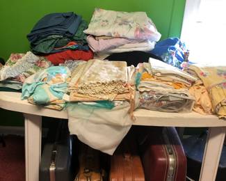 Linens- sheets, pillowcases, baby sheets, doilies, sofa cover, curtains, etc.  luggage