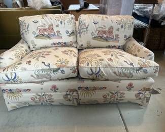 Cream decorative printed skirted loveseat