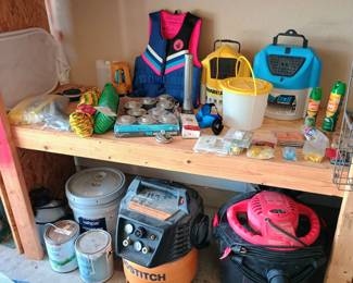 Assorted outdoor sporting goods items including live vest and fishing gear