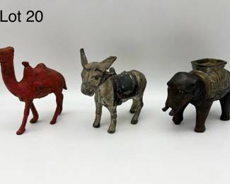 A Trio of Antique Cast Iron Still Banks Inc Elephant, Camel, and Donkey