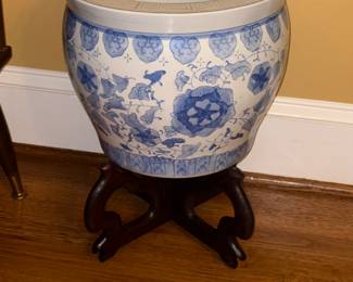 blue and white fishbowl planter