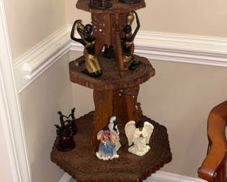 Three tier stand with African figurines