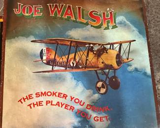 Lot of 9 vinyl records featuring various artists including Commander Cody, Joe Walsh, and L.T.D. Records from the 1970s. See images for details.