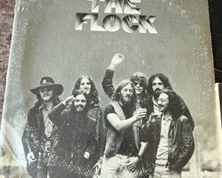 Vintage Vinyl Record Lot featuring diverse genres and artists. Includes albums from the 1960s and 1970s such as 'The Flock', 'Doc Watson on Stage', and 'Dawson's'. See pictures for more details.