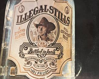 Vinyl Record Lot featuring various artists and albums including bluegrass and country music. Includes titles such as 'Lester Flatt and Earl Scruggs', 'Black Oak Arkansas', and 'Illegal Stills'. See pictures for more details.