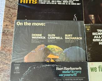 Vinyl Record Collection featuring classic hits from artists such as Johnny Rivers, Burl Ives, and Harry Belafonte. Includes titles like 'Golden Hits,' 'Greatest Hits,' and 'Spectacular.' Ideal for collectors and music enthusiasts. See pictures for details.