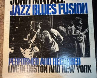 A collection of vintage vinyl records featuring John Mayall's 'Blues Alone', Pointer Sisters' 'Black & White', The 5th Dimension's album, and more. Ideal for collectors and music enthusiasts. See pictures for more details.