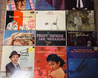 A collection of classic vinyl records featuring artists such as Buddy Holly, Andy Williams, Frank Sinatra, and others. Includes albums like 'Lonely Street' and 'Latin Affair.' Perfect for collectors and music enthusiasts. See pictures for details.