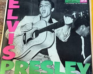 Vintage Vinyl Record Collection featuring iconic albums from the 1970s, including works by Elvis Presley, Johnny Cash, June Carter, Harry Chapin, and Michael Murphey. Merle Haggard and Willie Nelson when they were young aspiring artists! A must-have for collectors and music enthusiasts.