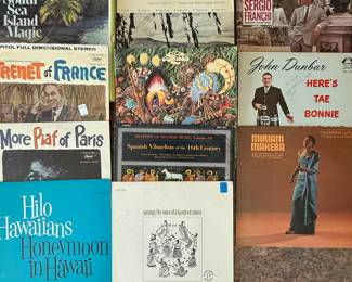 Includes a collection of vintage vinyl records from the 1960s and 1970s, featuring genres such as folk, world music, and educational records. Notable titles include 'Modern Spanish,' 'Hilo Hawaiians Honeymoon in Hawai'i,' and 'Here's Tae Bonnie.' See pictures for more details.