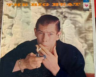 Vintage Vinyl Record Lot featuring Johnnie Ray's 'The Big Beat', The Ventures' 'Let's Go!', Ray Charles' 'What I Say', and Glenn Miller's collection. A must-have for music enthusiasts and collectors.