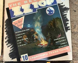 Vintage Vinyl Record Lot including 'Led Zeppelin III' (1970), 'The Best of ZZ Top' (1978), 'Rare Earth' (1971), and 'Fandango!' by ZZ Top (1975). See pictures for more details.