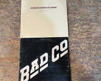 Vinyl Record Lot featuring 'Bad Company' and Earth Wind & Fire albums. See pictures for more details.