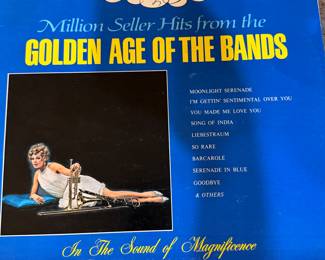 Vintage vinyl record collection featuring artists like Spinners, Duke Ellington, Glenn Miller, and others. Includes titles such as 'Used to Be Duke,' 'The Roaring 20's,' 'Coffee Break,' and 'Dream Dancing.' See pictures for more details.