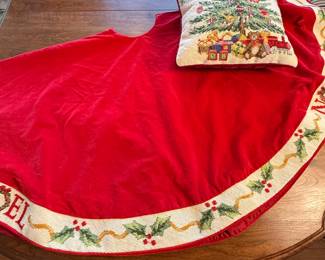 Includes a red velvet Christmas tree skirt with a decorative 'Noel' trim and a festive seasonal pillow featuring a Christmas tree design. Perfect for holiday decorations.