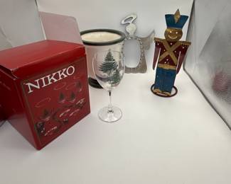 Includes four Christmas-themed wine glasses from NIKKO (year unknown) in a decorative box, a tree-themed ceramic planter, and a festive metal angel decoration.
