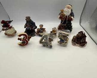 Includes various Christmas themed figurines from the 1990s, featuring brands such as Possible Dreams and Department 56. Items include Santa Claus, children with teddy bears, and decorative numbers 3, 4, and 5. Perfect for holiday collectors or seasonal decor.