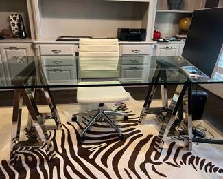 Stainless steel and thick glass office desk, Midway, office chair, and zebra rug