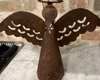 This rustic looking angel is actually a bell. The part that rings are her legs that dangle. Super cute.