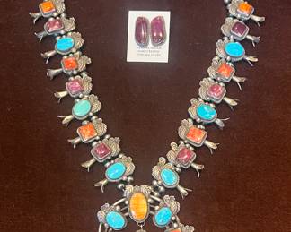Simply gorgeous! Squash, blossom necklace with orange and purple, spiny oyster and Turquoise. It comes with spiny oyster Earrings all of this is sterling silver.